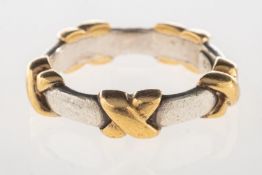 Tiffany & Co. A signature 'Kiss' ring, marked T&Co, 925, 750, Italy, size L to L1/2, 4.8grams.