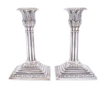 A pair of Victorian silver dwarf candlesticks by Hawksworth, Eyre & Co, Sheffield, 1874,