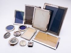 A collection of early 20th century silver photograph frames including; six rectangular frames,