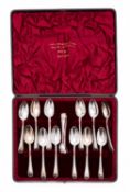 A cased set of twelve Victorian silver tea spoons and sugar tongs by James Deakin & Son,
