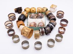 A mixed group of napkin rings including; an Arts and Crafts horn,