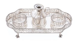 An Edward VII silver inkstand by Charles Stuart Harris, London 1901, of rectangular lobed form,
