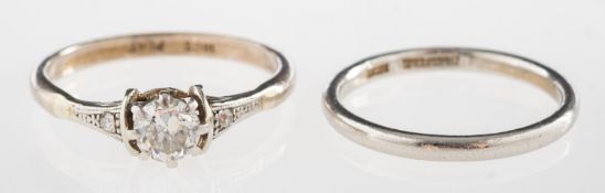 A diamond solitaire ring and a wedding band,