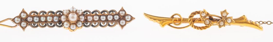 Two antique pearl set brooches, including a fluted openwork scroll brooch set with seed pearls,