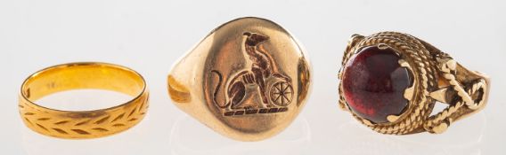 A group of three rings, including a 9ct gold signet ring with engraved crest, UK hallmark,
