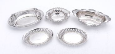 A mixed group of silver bon bon dishes including; a pair of oval dishes by Lee & Wigfull,