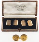 A pair of cufflinks and two buttons, a boxed pair of cufflinks with engine turned engraving,