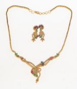 An Indian style diamond, emerald, sapphire and ruby necklace with matching earrings,