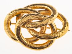 An entwined openwork brooch, with scroll and foliate engraving, pin and catch fitting, unmarked,