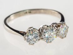A three stone diamond ring, claw set with three brilliant-cut diamonds, diamonds approx. 1.