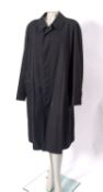 Burberry, London, a gentleman's black cotton raincoat.