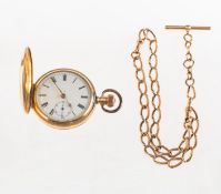 A gold-plated pocket watch with 9ct gold chain the dial having black Roman numerals,
