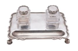 A George V silver inkstand by C S Harris & Sons Ltd, London 1913, of rounded rectangular form,
