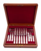 A cased set of twelve mother of pearl and close plated dessert knives and forks, unmarked,