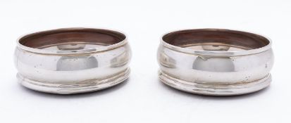 A pair of Elizabeth II silver wine bottle coasters by M C Hersey & Son Ltd, London 1998,