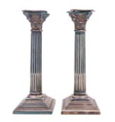 A pair of Elizabeth II silver Corinthian column candlesticks by Garrard & Co Ltd, London 1990,