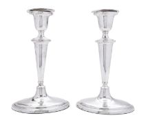 A pair of George III silver candlesticks by Samuel Deakin & Co, Sheffield date letter rubbed,