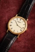 Patek-Phillipe a gold Calatraver gentleman's wristwatch the case having a milled edge bezel and