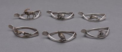 A matched set of Art Deco six silver animal napkin rings mostly by G & C Hodgetts,