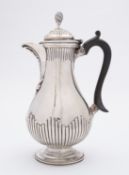 A Victorian silver hotwater jug by Charles Stuart Harris, London 1875,