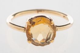 A citrine ring, claw set with a circular-cut citrine, indistinctly marked 585, size M, 2.2grams.