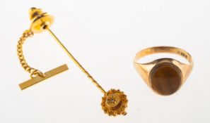 A 9ct gold tiger's eye signet ring and a stick pin,