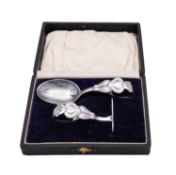 A George V silver child's pusher and spoon by Crisford & Norris Ltd, Birmingham 1926,