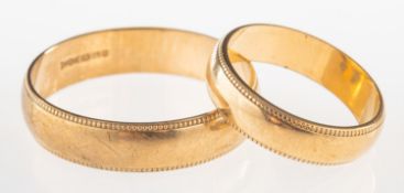 Two matching 9ct gold wedding bands, both with milgrain edges, sizes Z++ (?), and N to N1/2,