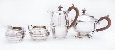 A matched George V four piece silver tea service Charles Boyton & Son Ltd comprising;