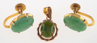 A pair of jade earrings and a pendant,