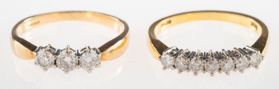 A group of two diamond rings, including an 18ct gold seven stone diamond ring, diamonds approx. 0.