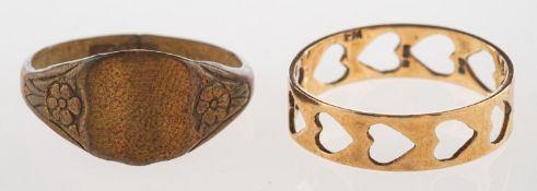 A heart designed ring and one other ring,