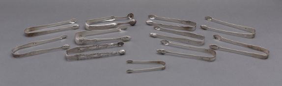 A mixed group of late 18th and early 19th century sugar tongs including;