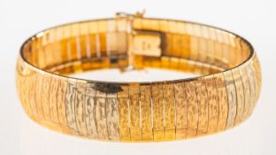 A tri-colour bracelet, with a textured & polished finish,