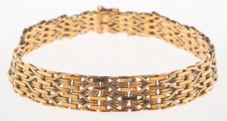 A fancy link bracelet, with articulated openwork links,