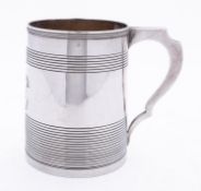 A George III small mug maker's mark almost rubbed out, London 1801, inverted tapering form,