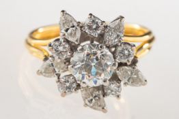 An 18ct gold diamond cluster ring, set to the centre with an old European-cut diamond,