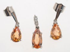 An Imperial topaz and diamond pendant and earrings,