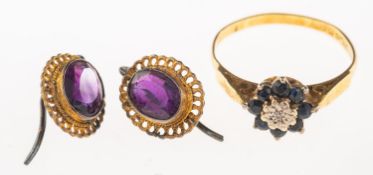 An 18ct gold sapphire and diamond ring and a pair of earrings,