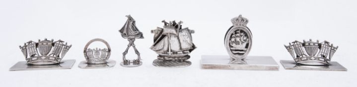 Royal Navy Interest: a group of silver and silver plated menu holders including;