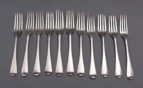 A matched set of eleven Hanoverian pattern table forks, mostly George III, various dates and makers,