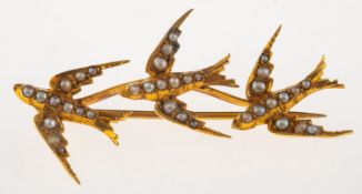 A Victorian triple swallow brooch, set with seed pearls, unmarked, length approx. 4.8cm, 4.3grams.