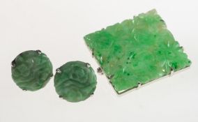 Two items of carved jade jewellery, including a square shaped brooch,