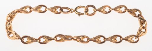 A fancy link bracelet, marked 9 .375 on all links, jump ring and 9ct on bolt ring, length approx.