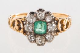 An antique emerald and diamond cluster ring,