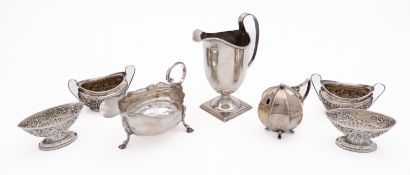 A mixed group of silver including; an Edward VII cream jug of helmet form by H.