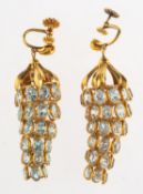 A pair of aquamarine chandelier earrings, a pair of drop earrings of openwork articulated design,
