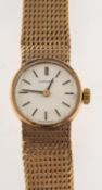 Longines : A 9ct gold vintage wristwatch,