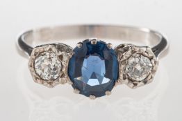 An 18ct gold sapphire and diamond three stone ring,
