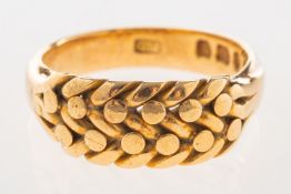 A Victorian 18ct gold keeper ring, with a braided section to the front, UK hallmark, size N, 6.